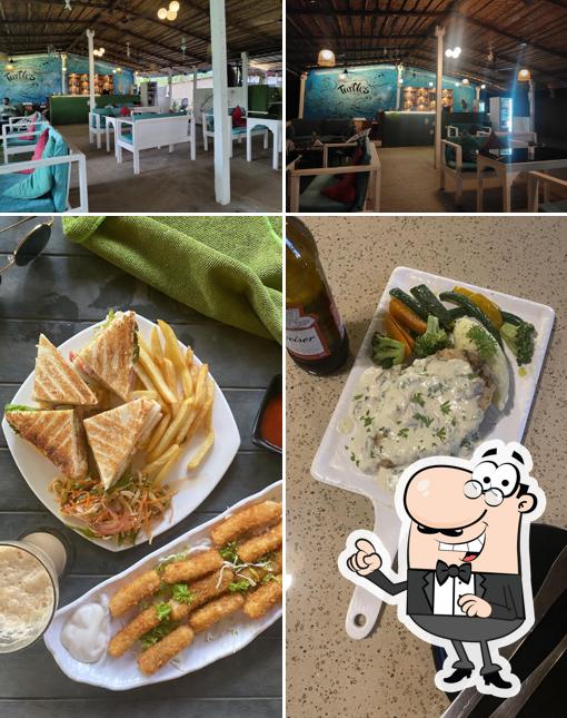 The photo of interior and food at Turtles Restaurant & Bar
