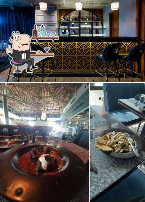 Take a seat at one of the tables at CUE - Culinary Urban Experience