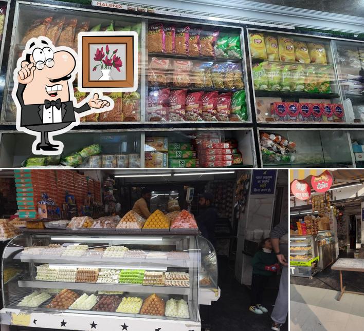 This is the image depicting interior and food at Sonu Sweet house