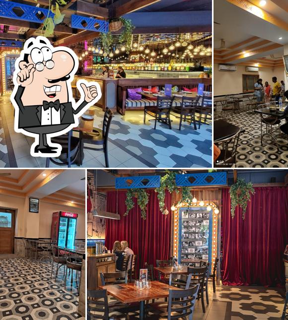 Take a seat at one of the tables at Bombay Restaurant (Hotel Bombay Inn’s Kitchen for Online Ordering and Takeaways)