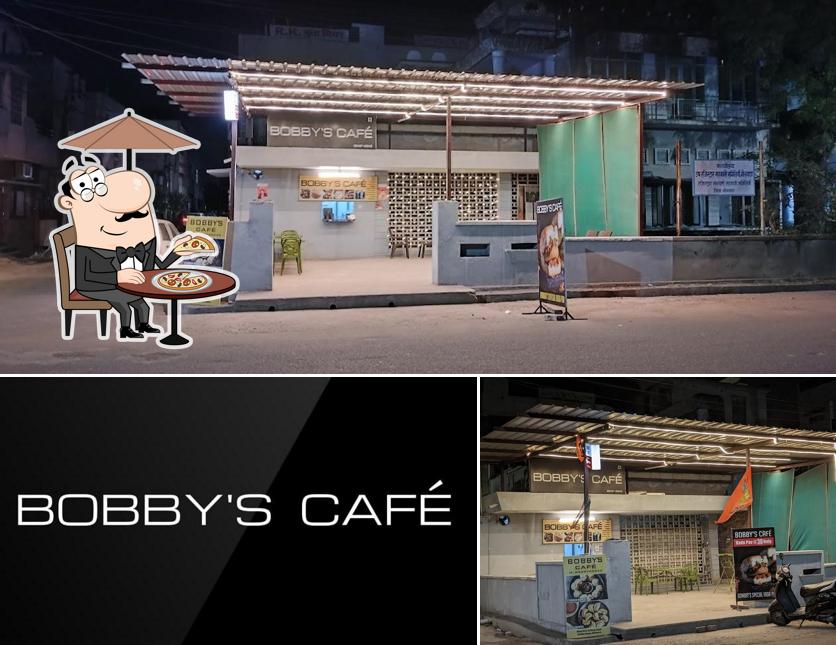 The photo of Bobby's Café’s exterior and blackboard