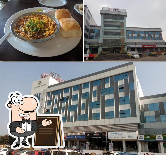 The photo of exterior and food at Hotel Preeti Executive