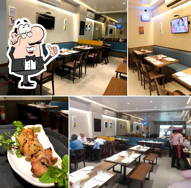 Take a seat at one of the tables at Delhi Darbar Express - Nariman Point