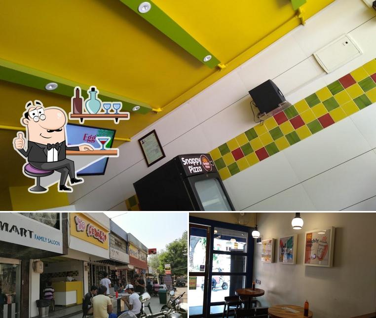 Take a seat at one of the tables at Yo Frankie, V.V.Nagar