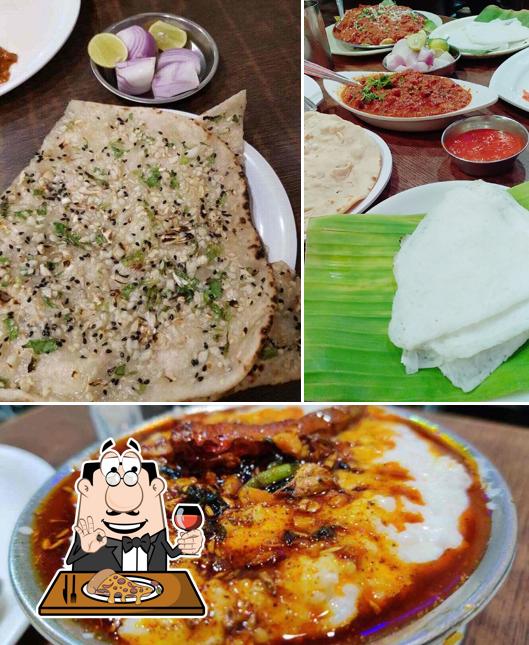 Get pizza at Nityanand Lunch Home