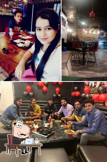 Take a seat at one of the tables at Tandoori Nights Restaurant & The Coffee Villa : Coffee Shops Cafe in Rewa