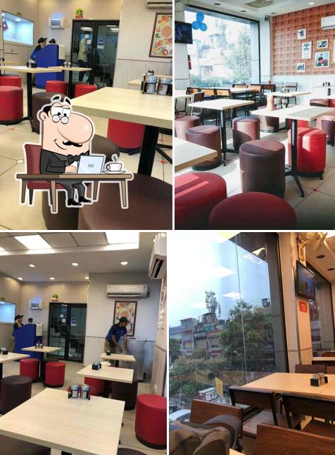 Take a seat at one of the tables at Domino's Pizza