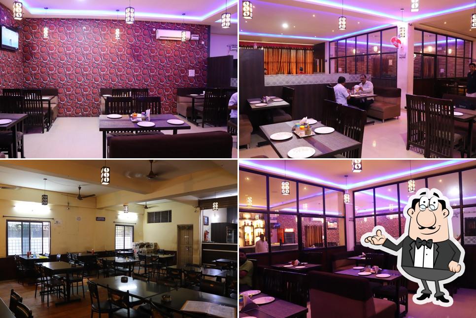 Take a seat at one of the tables at Nakshatra Restaurant and Bar