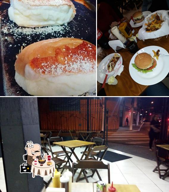 A ilustração da comida e interior no Walls Dogs & Burguers