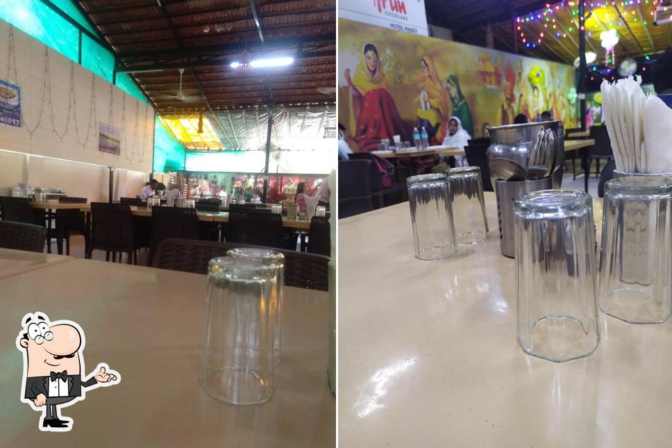 Take a seat at one of the tables at Hotel Rasoi