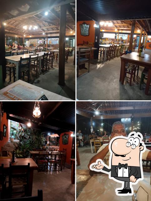 Sente em uma das mesas no Casa da Kátia Pizzas Rústicas