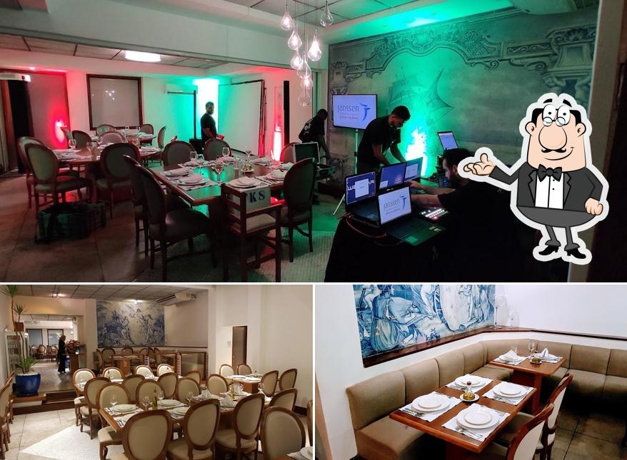 Sente em uma das mesas no Restaurante Lareira Portuguesa