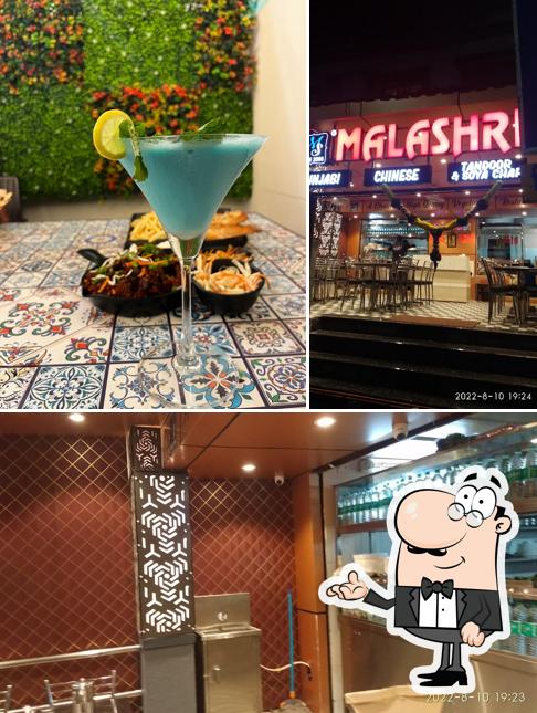 The photo of interior and beverage at Malashree Pure Veg