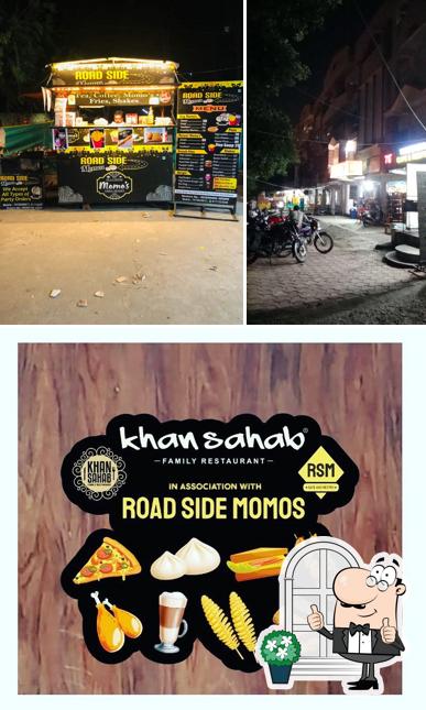 The picture of exterior and beverage at Roadside Momo's Cafe & Restro