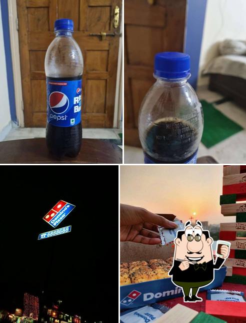 Enjoy a beverage at Domino's Pizza