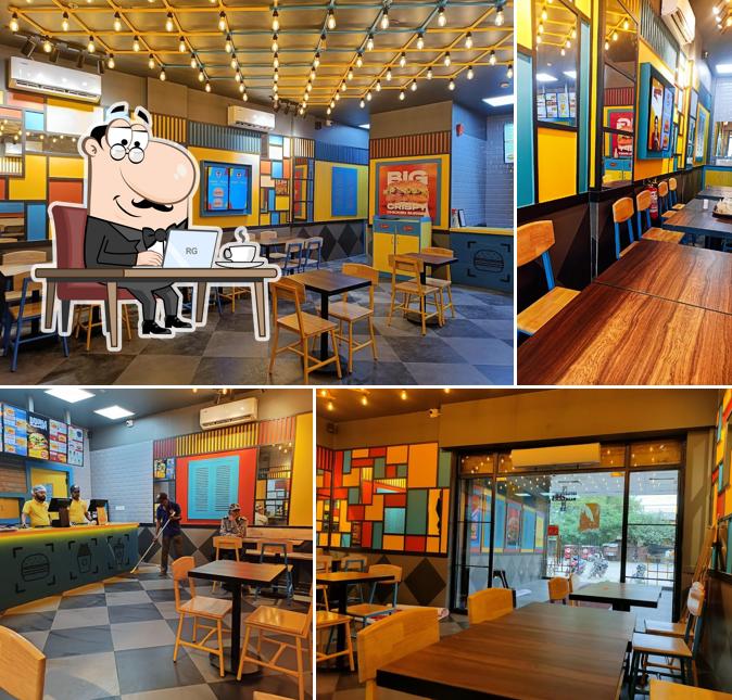 Take a seat at one of the tables at Burger Singh