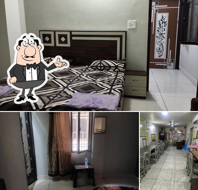 Take a seat at one of the tables at Old KHALSA DHABA and ROOMS