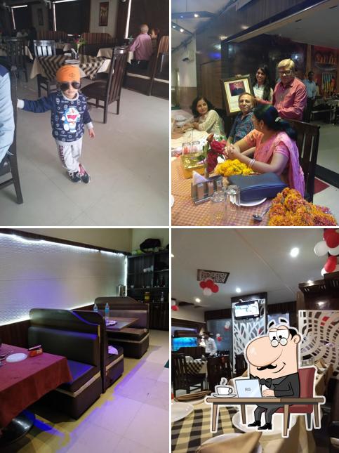 Take a seat at one of the tables at SHERE PUNJAB RESTAURANT AND CAFE