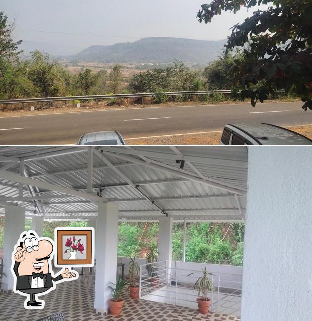 Take a seat at one of the tables at Konkan hill top family restaurant