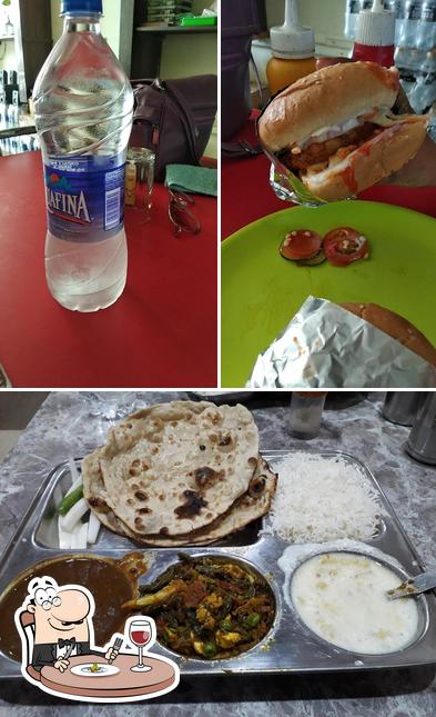 Take a look at the photo depicting food and beer at Punjabi Rasoi