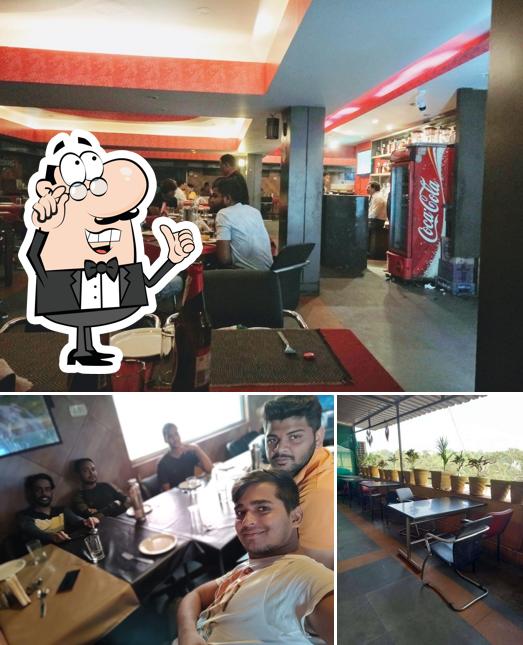 Take a seat at one of the tables at BLOOM BAR & RESTAURANT