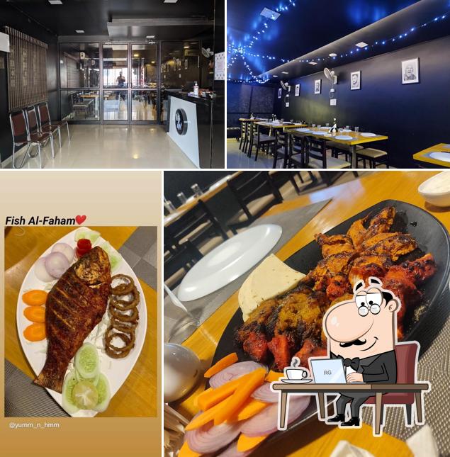 Check out the picture showing interior and food at The G.O.A.T Restaurant