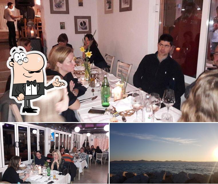 Questa è la immagine che raffigura la interni e esterno di Restaurant Delfin