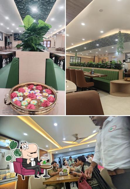 Take a seat at one of the tables at Sri Udupi Food Palace ಶ್ರೀ ಉಡುಪಿ ಫುಡ್ ಪ್ಯಾಲೇಸ್