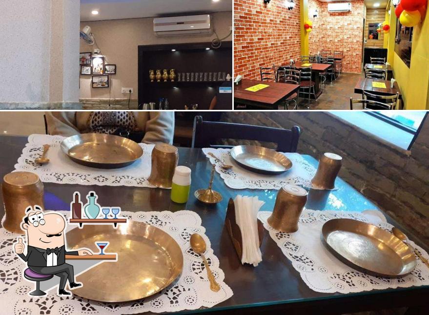 Take a seat at one of the tables at Aami Bangali