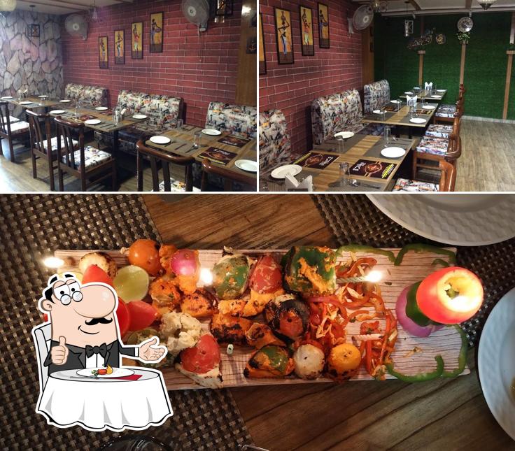 The image of dining table and food at Zaika The Restro