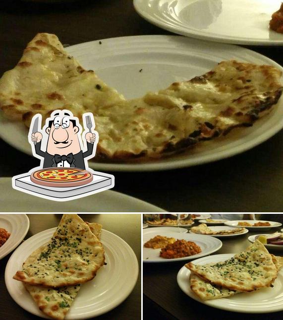 Get pizza at Savor Family Resto Bar