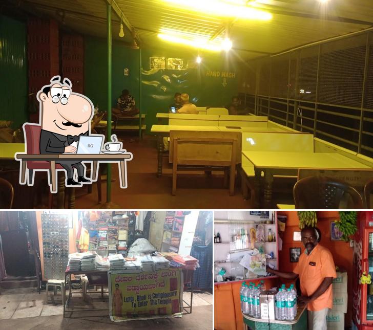 Take a seat at one of the tables at Mahalakshmi Restaurant Gokarn