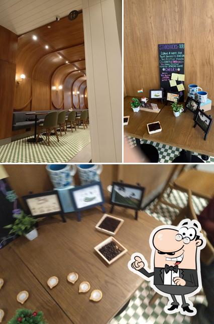 Take a seat at one of the tables at Starbucks