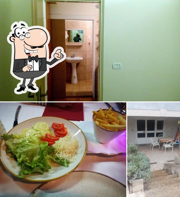 Siediti a un tavolo di Restoran Vili