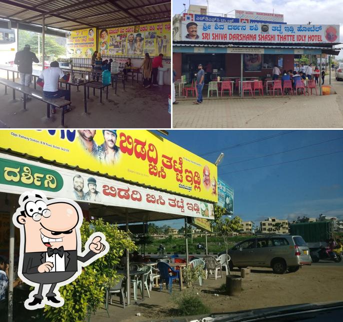 Take a seat at one of the tables at Hotel Shiva Dharshini