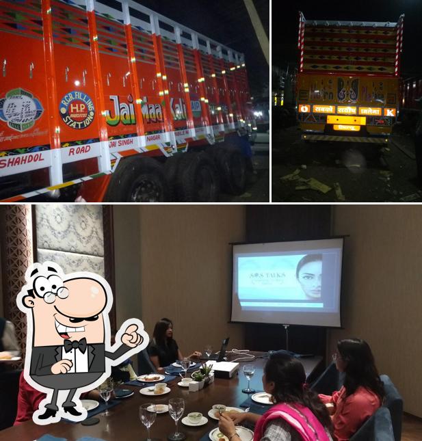 Take a seat at one of the tables at Shivaj Hotel And Restaurant