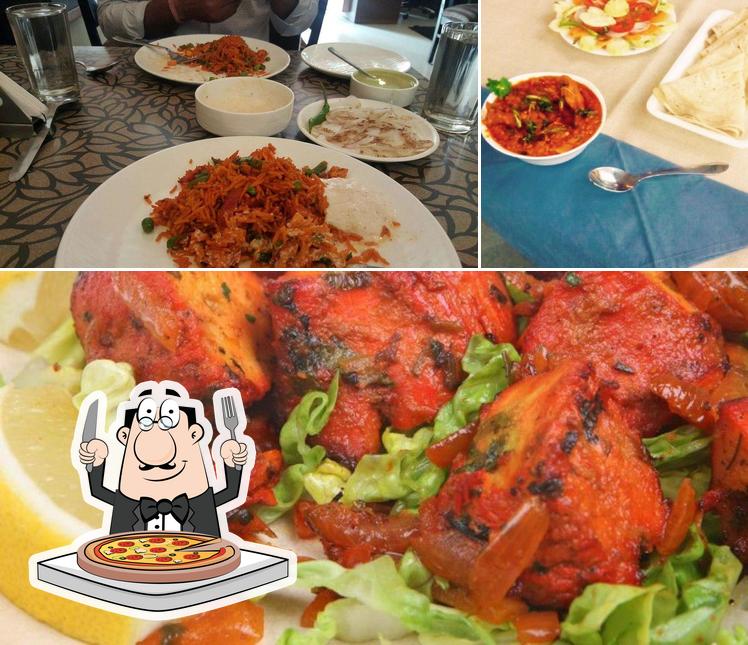 Get pizza at Hint of Spice