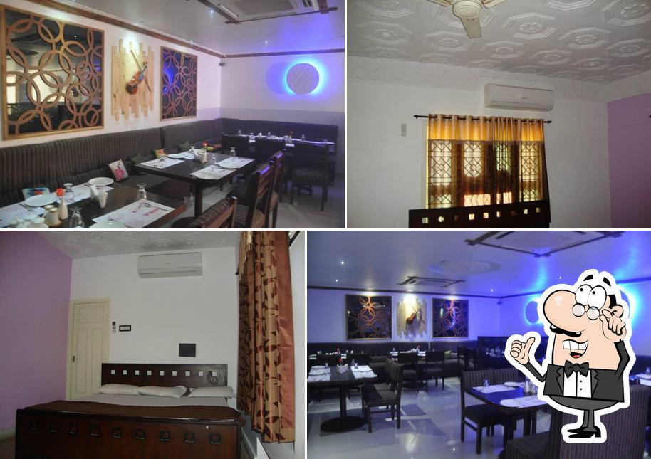 Take a seat at one of the tables at violin restaurant