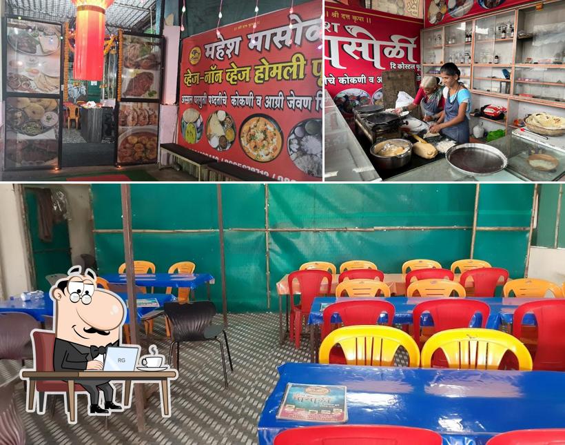 Take a seat at one of the tables at Mahesh masoli