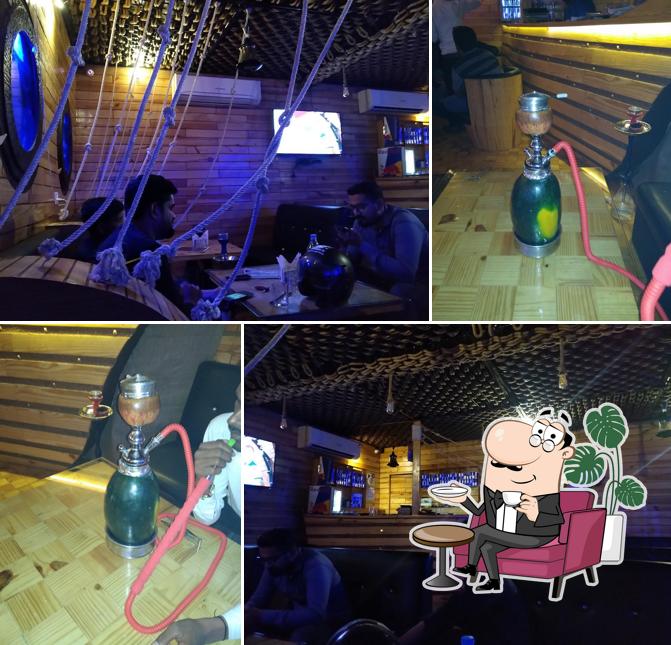 Take a seat at one of the tables at The Pirates Multicuisine Restro & Lounge