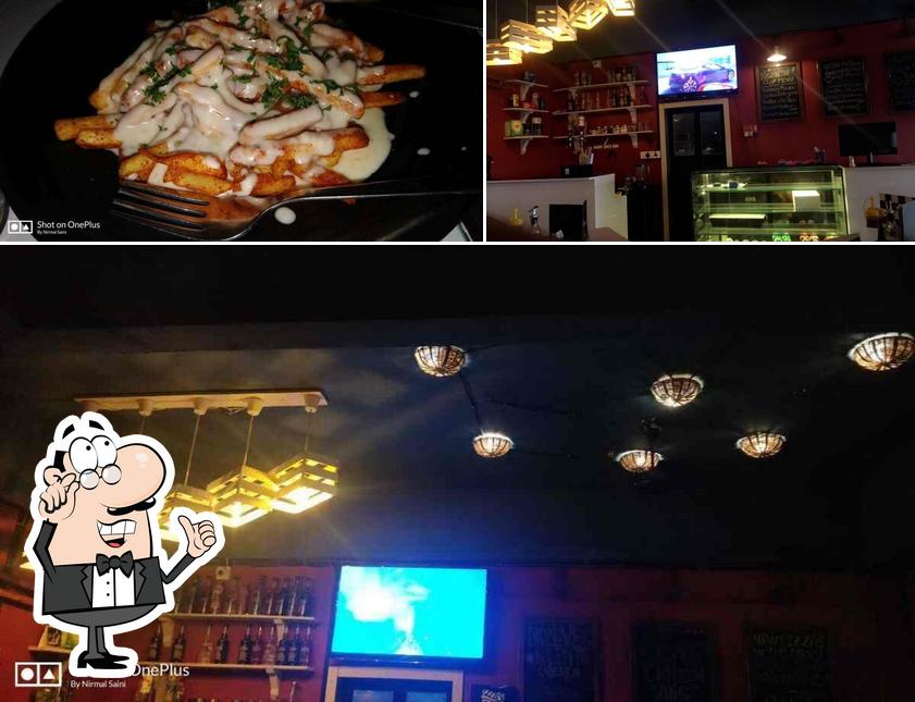 Take a look at the photo displaying interior and food at Uptown food Shack