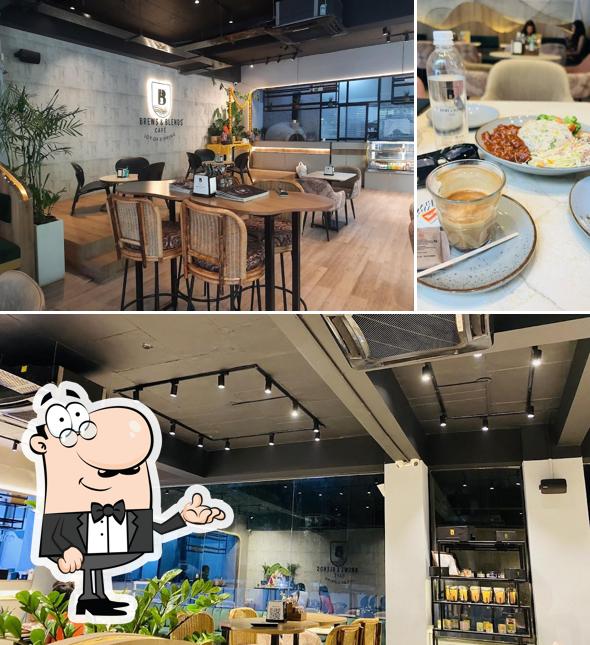 Take a seat at one of the tables at BREWS & BLENDS - Whitefields