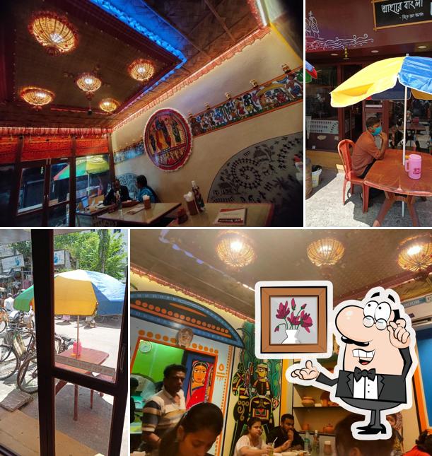 Take a seat at one of the tables at Aahare Bangla