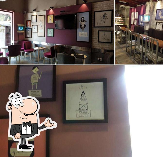 This is the image displaying interior and dining table at Café Coffee Day - Santoshpur