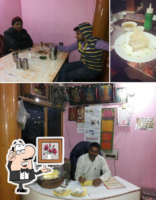 Check out the picture displaying interior and food at Swad Restaurant