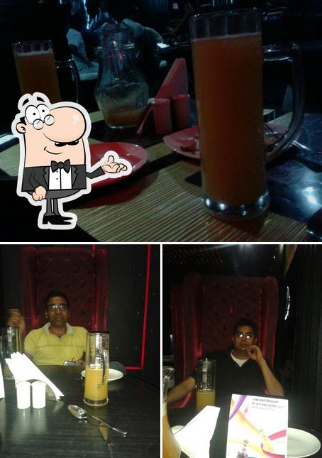 The photo of The Pizza Factory’s interior and beverage