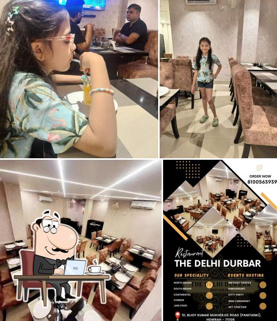 Take a seat at one of the tables at THE DELHI DURBAR