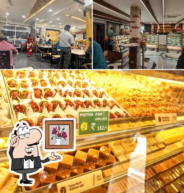 Take a seat at one of the tables at Shree Anandhaas Avinashi Road