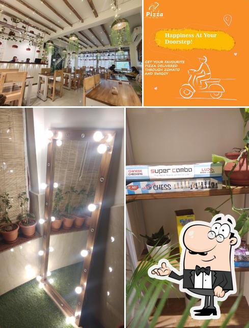 Take a seat at one of the tables at Pizza by the way