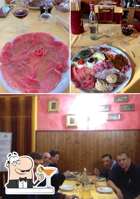 La immagine della bevanda e tavolo da pranzo di Trattoria Due Cuochi